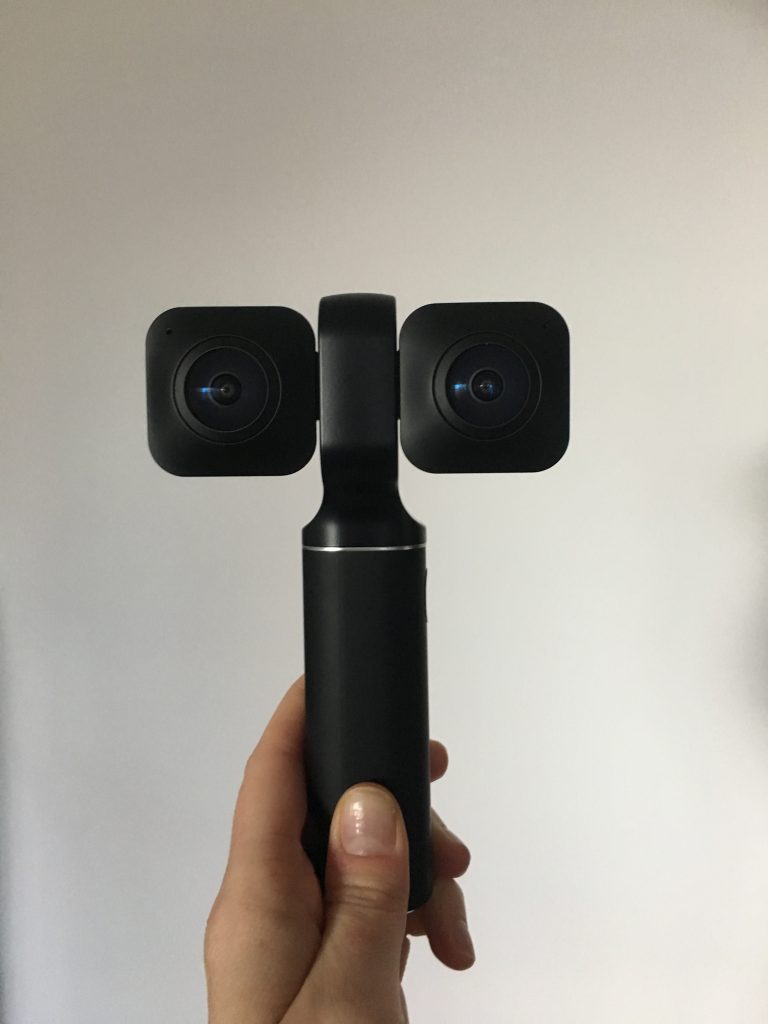 The Vuze XR camera's two lenses can be clicked together to shoot 360 video, or extended (like you see here) to shoot VR180 video.